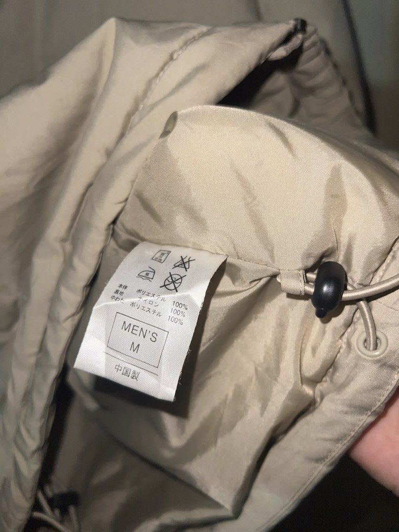 Vintage Y2K Nike Beige Full-Zip Puffer Jacket (Category: Coats, Jackets and Outerwear) located in Manila. Submitted by street_stitch777 (Listing ID 1466522973, Image 3). Description: - Brand: Nike - Era: Y2K / Early 2000s vintage - Size: Men's XL just M on tav - Color: Beige / Neutral earth tone - Details: Embroidered small black swoosh logo, zip chest pocket, lower hand pockets, and adjustable drawstring hem - Style: Full-zip puffer jacket, perf