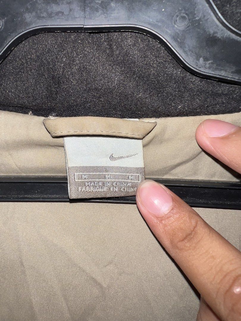Vintage Y2K Nike Beige Full-Zip Puffer Jacket (Category: Coats, Jackets and Outerwear) located in Manila. Submitted by street_stitch777 (Listing ID 1466522973, Image 2). Description: - Brand: Nike - Era: Y2K / Early 2000s vintage - Size: Men's XL just M on tav - Color: Beige / Neutral earth tone - Details: Embroidered small black swoosh logo, zip chest pocket, lower hand pockets, and adjustable drawstring hem - Style: Full-zip puffer jacket, perf