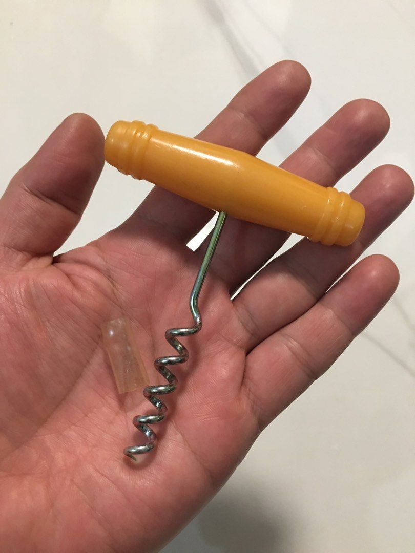 Vintage yellow handle corkscrew bottle opener wine tool (Category: Vintage Collectibles) located in Pasay City. Submitted by gilbertso62551 (Listing ID 1466472125, Image 1). Description: - Bright yellow plastic handle with ribbed details for a solid, comfortable grip - Durable metal screw equipped with a clear protective cap on the tip - Simple manual design for quick and effortless wine bottle opening - Clean condition and ready for immediate us