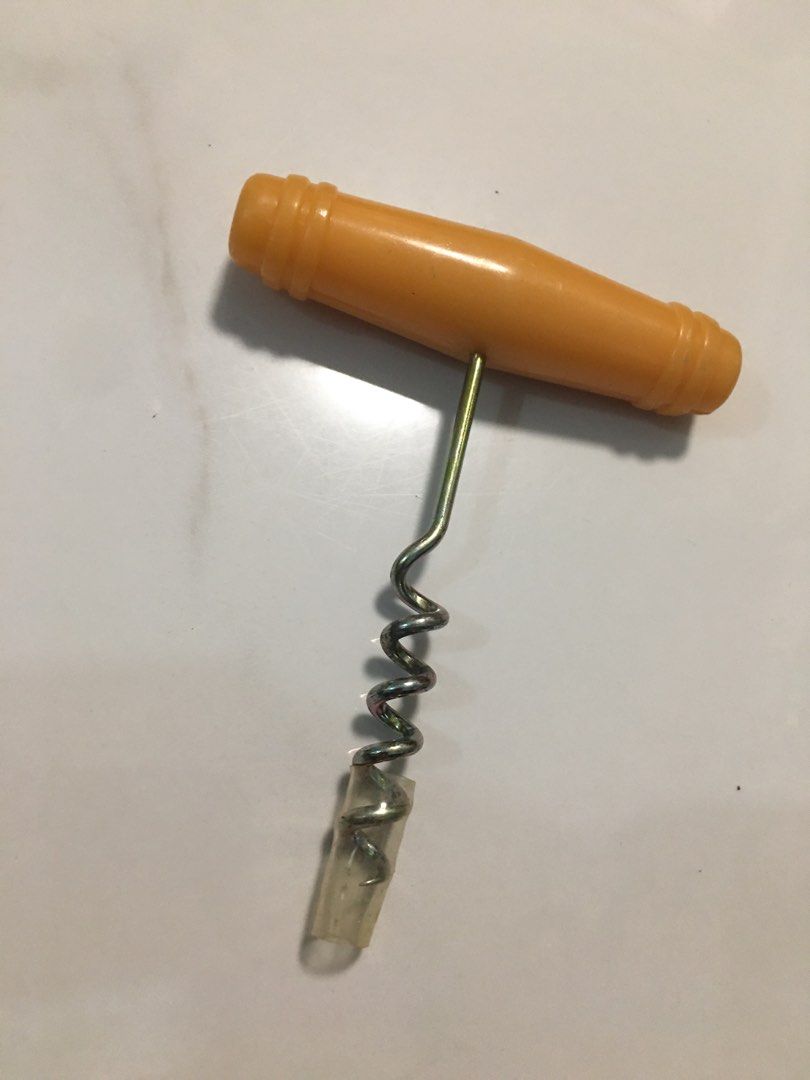 Vintage yellow handle corkscrew bottle opener wine tool (Category: Vintage Collectibles) located in Pasay City. Submitted by gilbertso62551 (Listing ID 1466472125, Image 3). Description: - Bright yellow plastic handle with ribbed details for a solid, comfortable grip - Durable metal screw equipped with a clear protective cap on the tip - Simple manual design for quick and effortless wine bottle opening - Clean condition and ready for immediate us