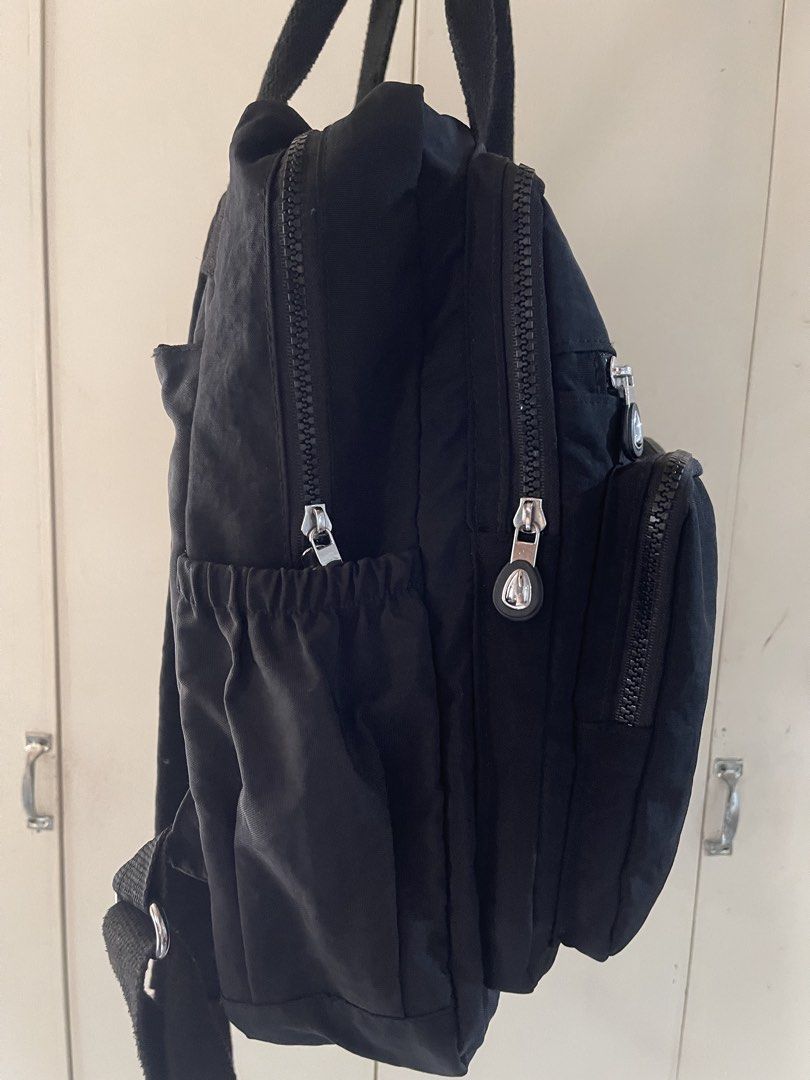 Volganik Rock Black Nylon Backpack (From US) (Category: Backpacks) located in Manila. Submitted by bray.skieee (Listing ID 1466375912, Image 3). Description: - Brand: Volganik Rock - Color: Black - Material: Durable, high-quality nylon - Design: Clean minimalist style, great for daily commutes, laptop, school, or travel - Storage: Multiple exterior zippered front/side compartments and side elastic pockets - Comfort: Sturdy top grab handles and ad