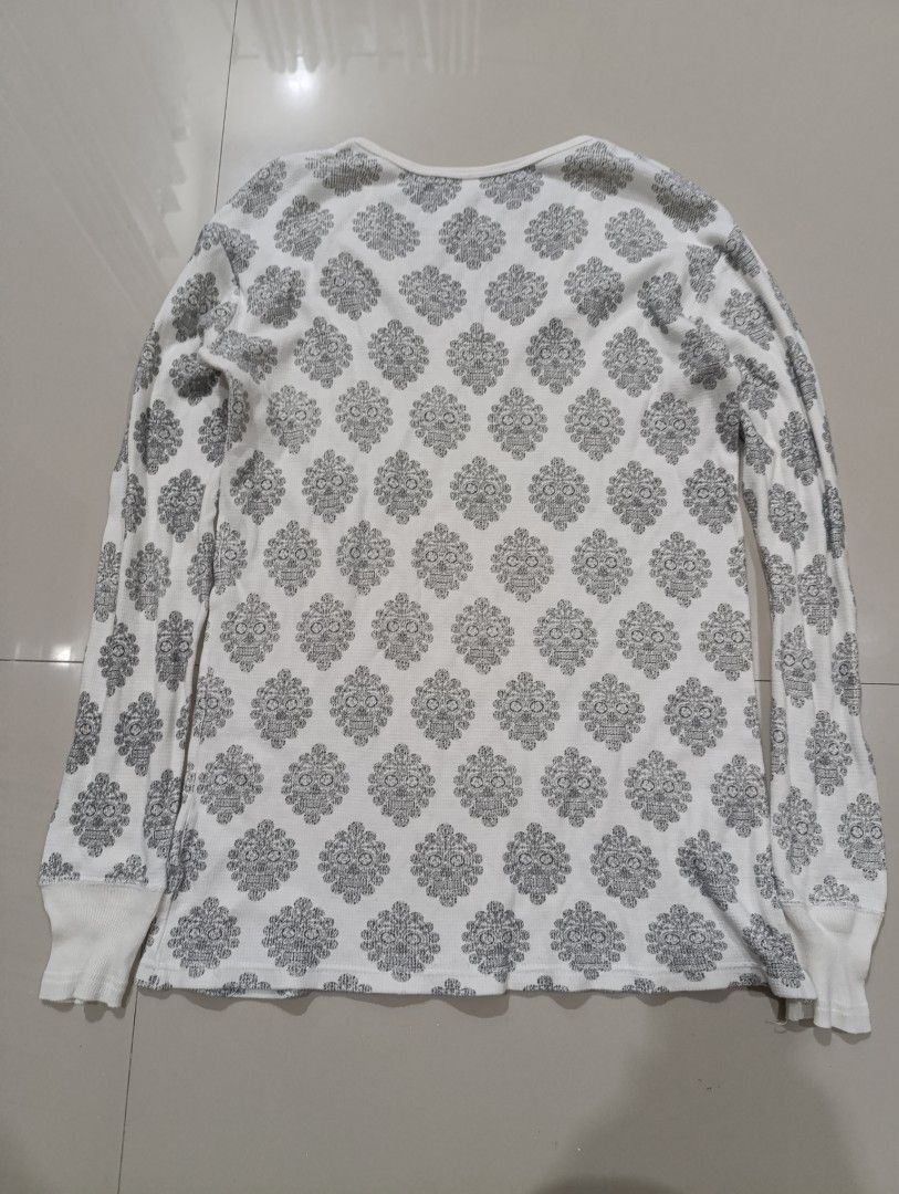 Wacko Maria Skull Print Long Sleeve (Category: Longsleeves) located in Davao. Submitted by idioticthrifter (Listing ID 1466553005, Image 3). Description: - Brand: Wacko Maria - Item: Thermal long sleeve shirt - Color/Pattern: White with all-over black skull and floral print - Details: V-neck, ribbed cuffs, sleeve woven label, and hem tag - Material: 100% cotton, Made in Japan - Size: S - Care: Hand wash only - Condition: Excellent/Ready to ship -
