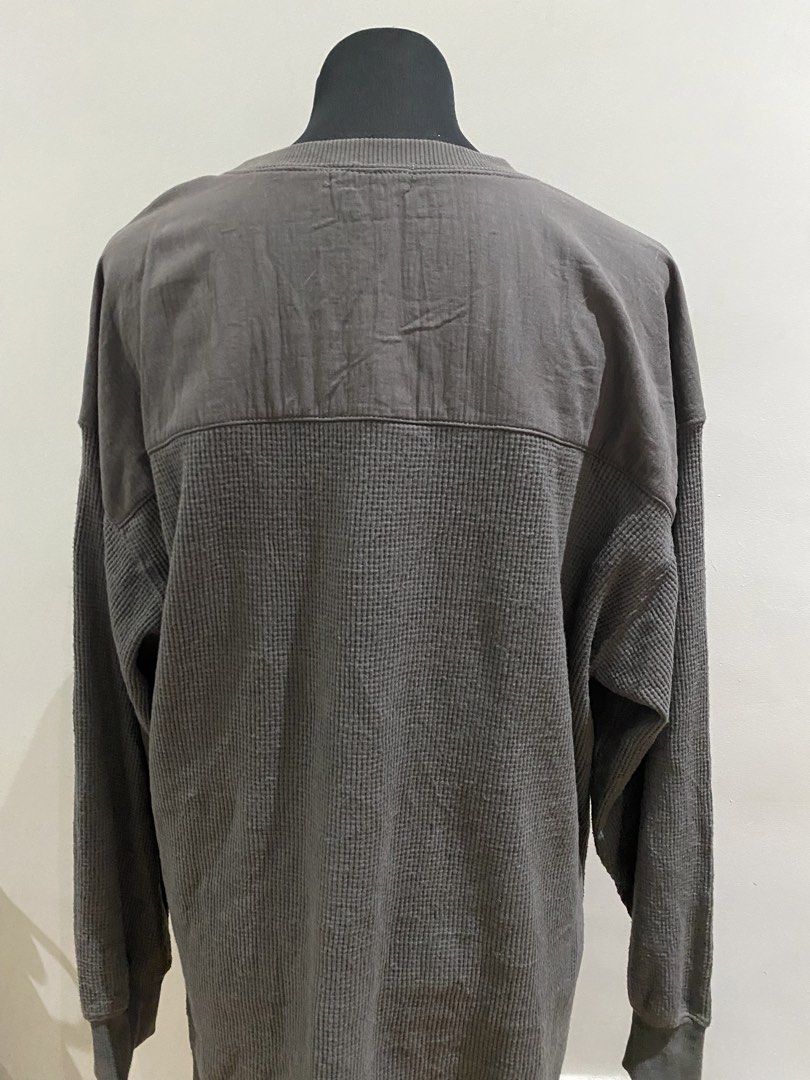 Waffle Knit Long Sleeve Sweater Grey (Category: Longsleeves) located in Manila. Submitted by mpt99876 (Listing ID 1466516240, Image 3). Description: - Brand: Samansa Mos2 - Color: Versatile Grey - Material: Soft textured waffle knit fabric - Fit: Relaxed fit with long sleeves and ribbed crew neckline - Design: 'peace begins with a smile' letter print in a slightly metallic font - Special Detail: Contrasting woven fabric panel on the upper back - 