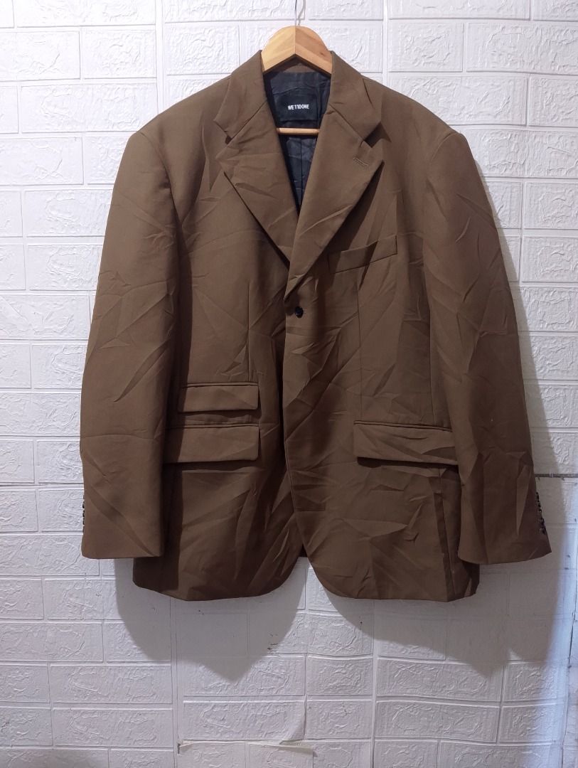 We11done SS 2020 Brown Blazer Jacket Size L (Category: Coats, Jackets and Outerwear) located in Cavite. Submitted by marvzclothing (Listing ID 1466461064, Image 1). Description: - Brand: We11done (SS 2020 Collection) - Color: Brown - Closure: Single button front - Details: Multiple flap pockets, button cuffs, structured shoulders, lined interior - Signature Element: Silver W hardware logo on the back collar - Condition: Clean fabric overall with 