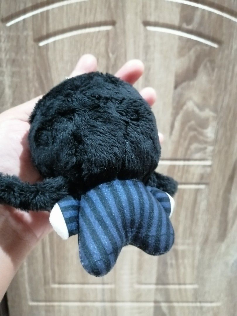 Wednesday Addams Plush Keychain (Category: Plushies & Soft Toys) located in Angono. Submitted by rlinee_93 (Listing ID 1466464773, Image 3). Description: - Character: Wednesday Adddams hair Twisted - Outfit: Night Raven College uniform with blue and black stripes - Features: Soft black hair, sleepy expression, and embroidered face details - Attachment: Silver ball chain for easy hanging on bags or keys - Condition: Clean, and well-maintained.