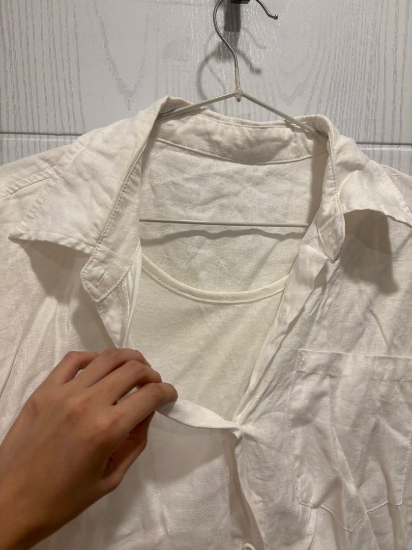 White Button-Up Shirt with Attached Inner Tank Top (Category: Shirts) located in Mandaluyong City. Submitted by shopwithjuu (Listing ID 1466421911, Image 3). Description: White oversized button-up shirt with a built-in inner tank top layer. Features a relaxed fit, classic collar, chest pocket, and high-low hem. Lightweight and perfect for casual everyday layering..