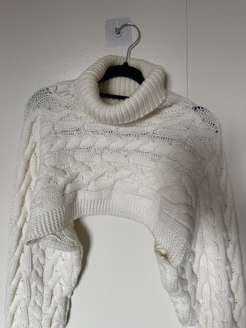 White cable knit turtleneck crop sweater (Category: Longsleeves) located in Mandaluyong City. Submitted by youarecutejeans (Listing ID 1466441081, Image 1). Description: - Color: White - Style: Cable knit turtleneck with super cropped cut - Details: Long sleeves with ribbed cuffs, heavy knit texture - Fit/Use: Great statement piece for layering .
