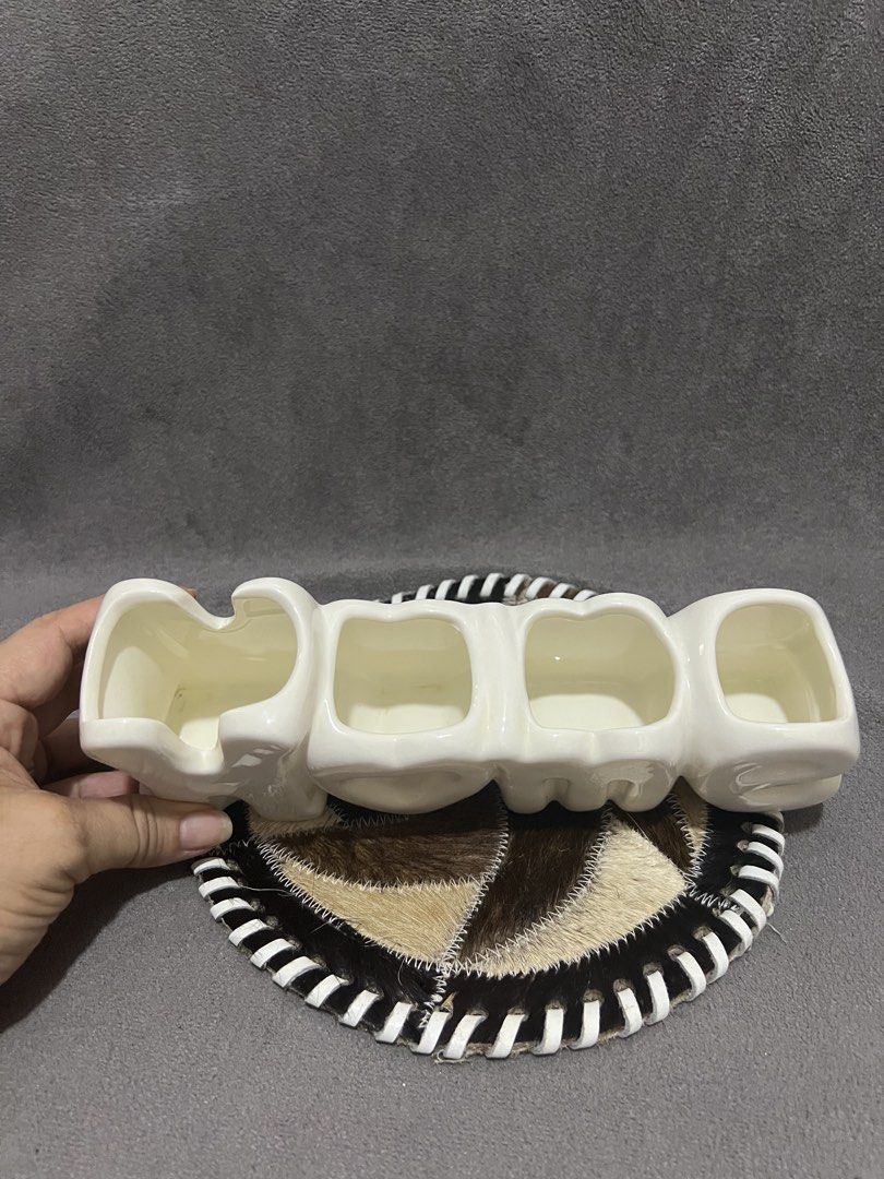 White Ceramic HOME Letter Vase Holder (Category: Vases & Decorative Bowls) located in Las Pinas. Submitted by maple0305 (Listing ID 1466413403, Image 3). Description: - Material: White ceramic with a glossy finish - Design: Home lettering with 4 distinct compartments - Condition: Smooth surface, no chips or cracks, sits flat on any tabletop - Perfect for: Small flowers or plant propagations - Aesthetic: Neutral color that complements most room de