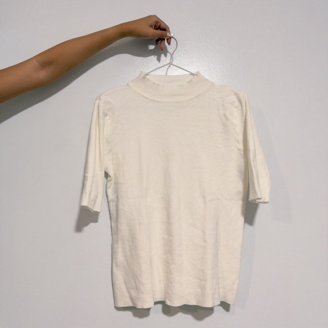 white crew neck knit top (Category: Blouses) located in Cebu City. Submitted by cuteoncue (Listing ID 1466556740, Image 2). Description: large-xl please see last photo for barely visible washable stain. the item was freshly laundered but not soaked or stain-treated..