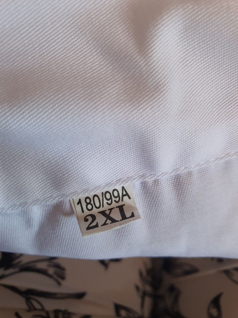 White Lab Coat Size 2XL 180/99A (Category: Coats, Jackets and Outerwear) located in Binangonan. Submitted by everythingmustgo78 (Listing ID 1466409918, Image 3). Description: - Color: Clean solid white - Size: 2XL (180/99A) - Design: Long sleeves with elastic cuffs, front pockets, button-up front, and notched lapel collar - Ideal for: Laboratory work, medical use, or school requirements.