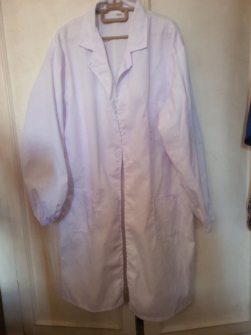 White Lab Coat Size 2XL 180/99A (Category: Coats, Jackets and Outerwear) located in Binangonan. Submitted by everythingmustgo78 (Listing ID 1466409918, Image 1). Description: - Color: Clean solid white - Size: 2XL (180/99A) - Design: Long sleeves with elastic cuffs, front pockets, button-up front, and notched lapel collar - Ideal for: Laboratory work, medical use, or school requirements.