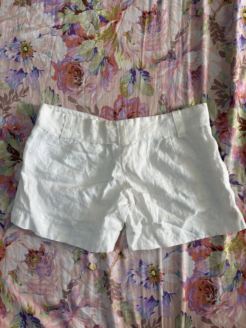 White linen shorts with belt loops and button closure (Category: Shorts) located in Paranaque City. Submitted by delikaite (Listing ID 1466413990, Image 2). Description: - Style: Classic summer white linen shorts - Fit: Structured waistband with belt loops, back darts for a fitted look - Closure: Front zipper and button - Material: Lightweight, breathable fabric perfect for warm weather - Versatility: Easy to pair with any basic tee or tank top.