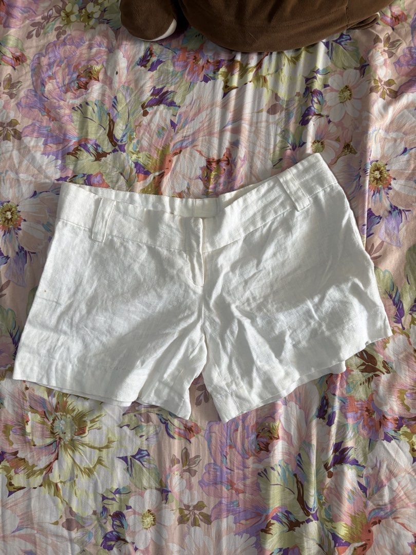 White linen shorts with belt loops and button closure (Category: Shorts) located in Paranaque City. Submitted by delikaite (Listing ID 1466413990, Image 1). Description: - Style: Classic summer white linen shorts - Fit: Structured waistband with belt loops, back darts for a fitted look - Closure: Front zipper and button - Material: Lightweight, breathable fabric perfect for warm weather - Versatility: Easy to pair with any basic tee or tank top.