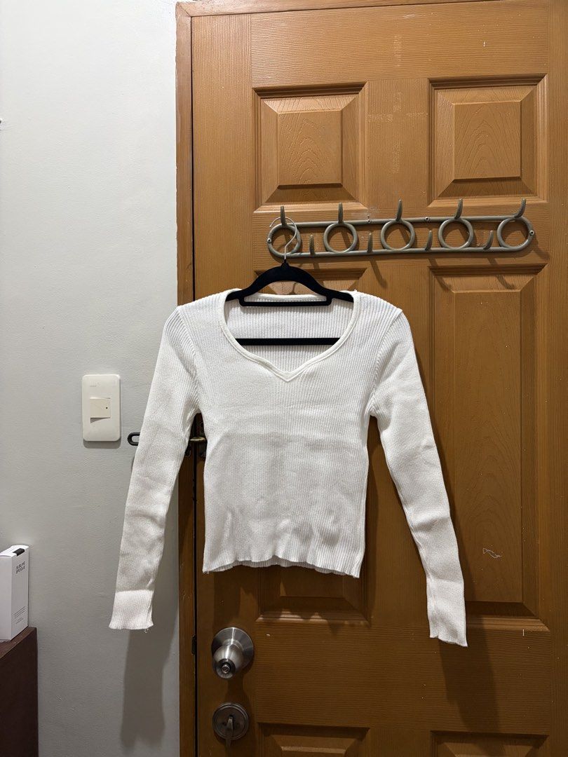 White long sleeve ribbed knit sweater with square neckline (Category: Longsleeves) located in Manila. Submitted by sooprmav (Listing ID 1466549421, Image 1). Description: - Color: Clean solid white - Style: Ribbed knit top with long sleeves - Neckline: Square neck with a cute center V-cut detail - Fit: Slim-fitting to flatter your figure - Material: Soft, high-quality knit with great stretch - Versatile piece, perfect for casual or dressed-up loo