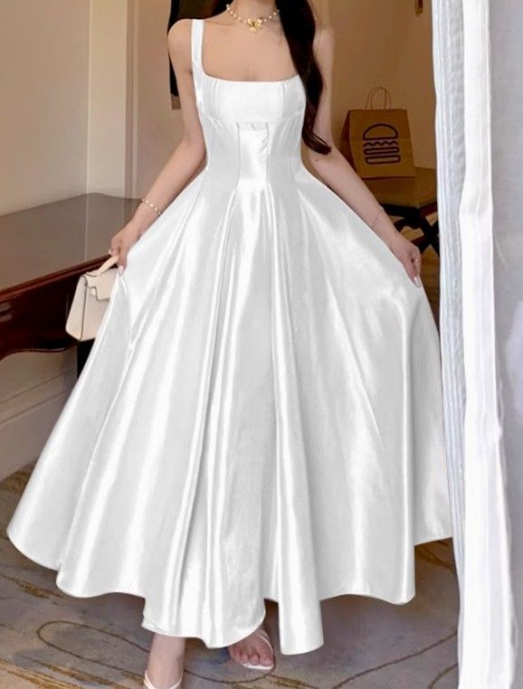 White Satin Square Neck Maxi Dress (Category: Dresses) located in Baguio. Submitted by shopmycl0sets (Listing ID 1466337456, Image 1). Description: ✔️Size: Can fit S-Semi Medium ✔️Color & Material: Heavy glossy WHITE satin with a smooth finish ✔️Design: Square collar, thick straps, and fitted bodice ✔️Silhouette: Full, voluminous floor-length skirt with structured front waist pleats and subtle draping ✔️Closure: with side zipper ✔️Condition: Bran