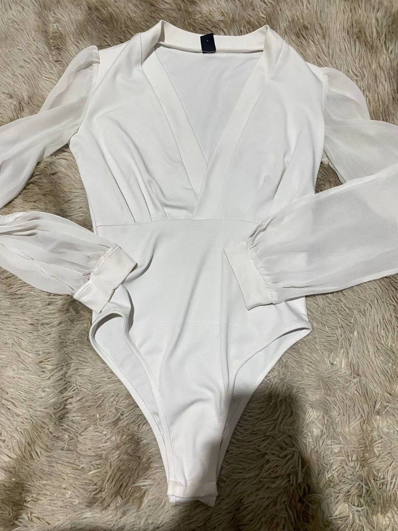 White Wrap-Front Long-Sleeve Bodysuit (Category: Bikinis & Swimsuits) located in Manila. Submitted by jnmgo (Listing ID 1466563410, Image 1). Description: PRELOVED CLOTHES ✨ Decluttering my closet! 📌 See photos for actual condition 📌 PM for measurements/details 📌 Can do bundle discounts 📌 Shipping available.