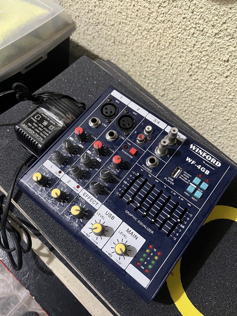 Winford WF-4GB Professional Audio Mixer (Category: Soundbars, Speakers & Amplifiers) located in General Trias. Submitted by tweakyohead (Listing ID 1466447375, Image 2). Description: Winford WF-4GB 4-Channel Audio Mixer – Blue Finish Condition: Excellent condition. Clean faceplate with minimal signs of handling. All knobs and faders are intact and fully functional. Included: Power adapter plug Features: • Multiple channel inputs • Graphic equaliz