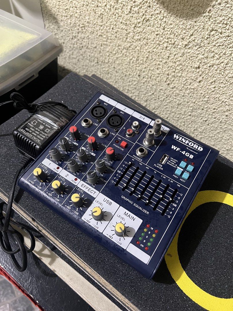 Winford WF-4GB Professional Audio Mixer (Category: Soundbars, Speakers & Amplifiers) located in General Trias. Submitted by tweakyohead (Listing ID 1466447375, Image 1). Description: Winford WF-4GB 4-Channel Audio Mixer – Blue Finish Condition: Excellent condition. Clean faceplate with minimal signs of handling. All knobs and faders are intact and fully functional. Included: Power adapter plug Features: • Multiple channel inputs • Graphic equaliz
