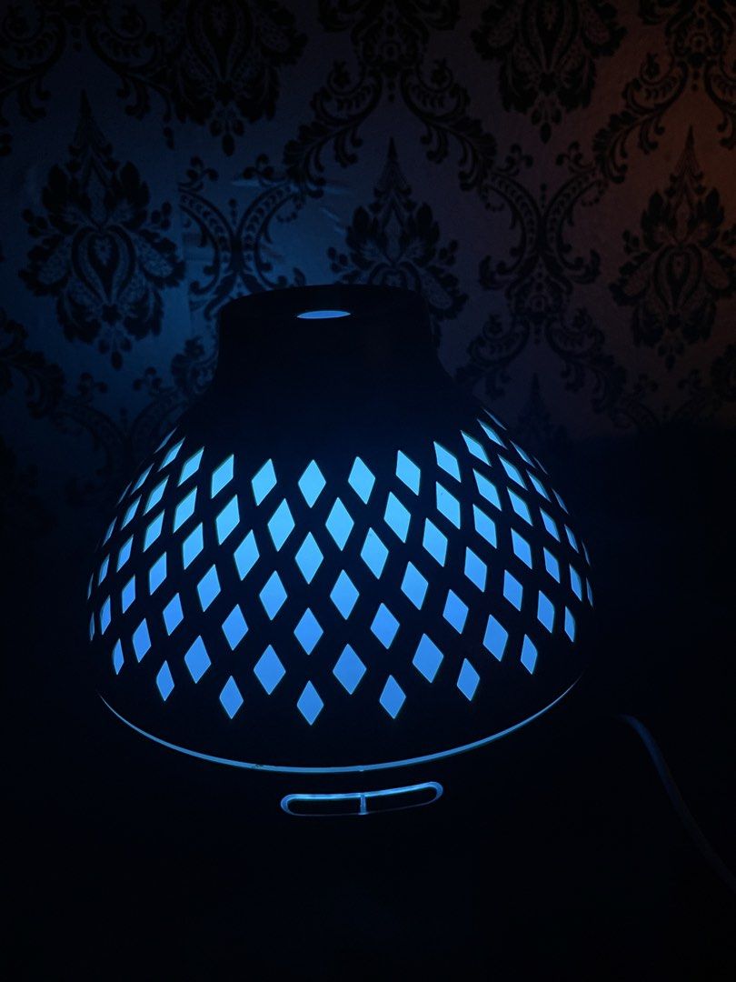 Wood Grain Essential Oil Diffuser with LED Lights (Category: Home Fragrance) located in Cavite. Submitted by Daspark25 (Listing ID 1466464703, Image 3). Description: - Elegant wood grain finish with a chic diamond cutout pattern - Multi-color LED lighting featuring red, blue, and purple options - Convenient front control buttons with 1H, 3H, and 6H timer settings - Compact design, perfect for desks or nightstands - Excellent performance, fills th