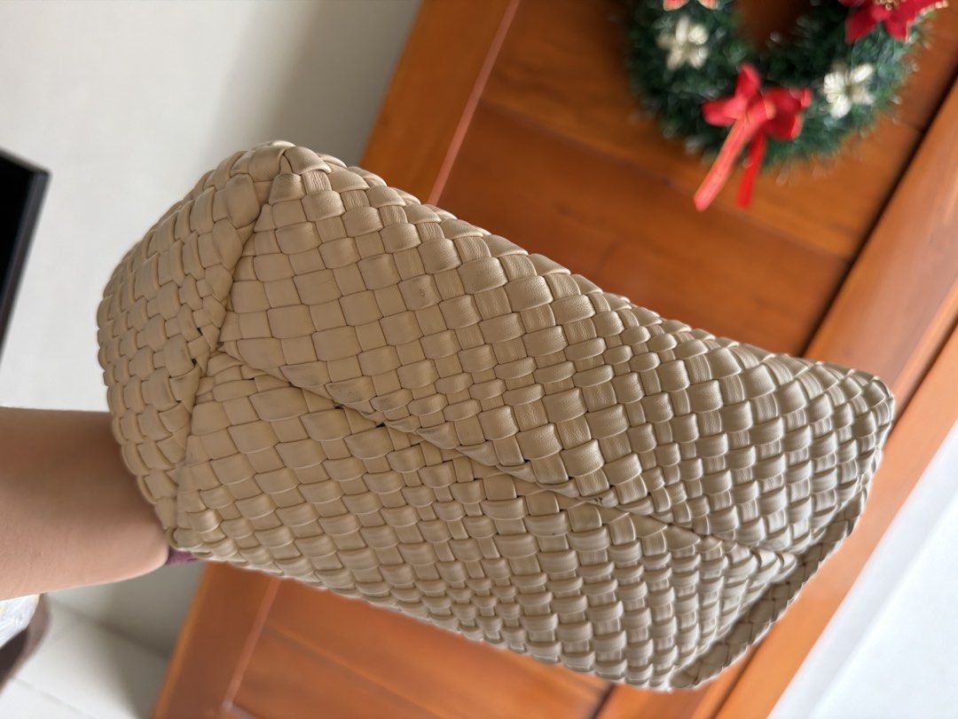 Woven Beige Tote Bag Shoulder Bag (Category: Shoulder Bags) located in Quezon City. Submitted by sarahjane_99 (Listing ID 1466369763, Image 3). Description: -Bought in Thailand for ₱800. Selling for a reasonable price. - Beige woven faux leather tote bag with intricate basketweave pattern - Comfortable matching braided straps - Structured flat base maintains a solid shape - Open top design equipped with interior D-rings - Spacious interior easily