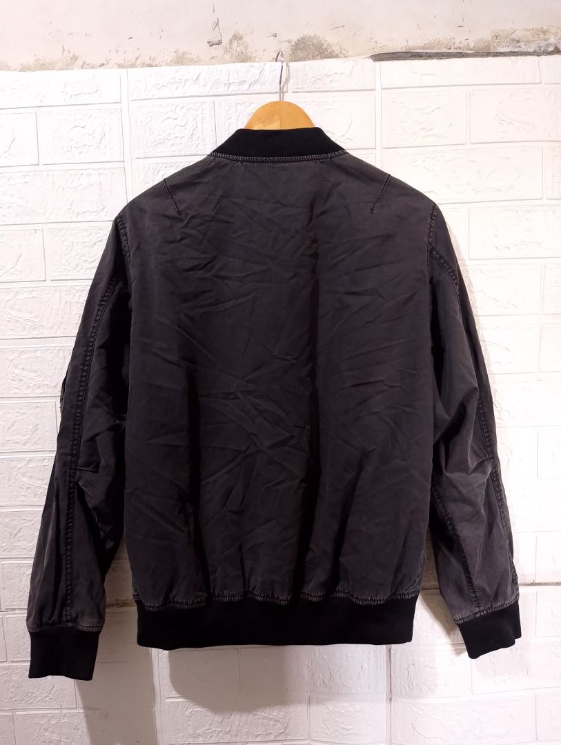 XLARGE Type DL-1 Bomber Jacket Black Size L (Category: Coats, Jackets and Outerwear) located in Cavite. Submitted by marvzclothing (Listing ID 1466458441, Image 2). Description: - Brand: XLARGE - Size: Large - Color: Black - Material: Cotton shell with polyester lining - Design: Military-inspired with XL Air Force graphic on the sleeve and utility pocket - Details: Ribbed collar, cuffs, and hem, full zip closure with brand patch, and authentic re