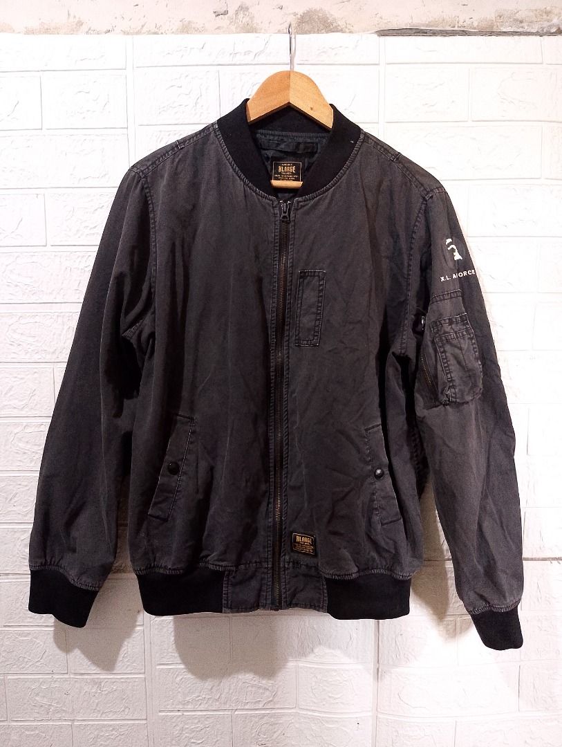 XLARGE Type DL-1 Bomber Jacket Black Size L (Category: Coats, Jackets and Outerwear) located in Cavite. Submitted by marvzclothing (Listing ID 1466458441, Image 1). Description: - Brand: XLARGE - Size: Large - Color: Black - Material: Cotton shell with polyester lining - Design: Military-inspired with XL Air Force graphic on the sleeve and utility pocket - Details: Ribbed collar, cuffs, and hem, full zip closure with brand patch, and authentic re
