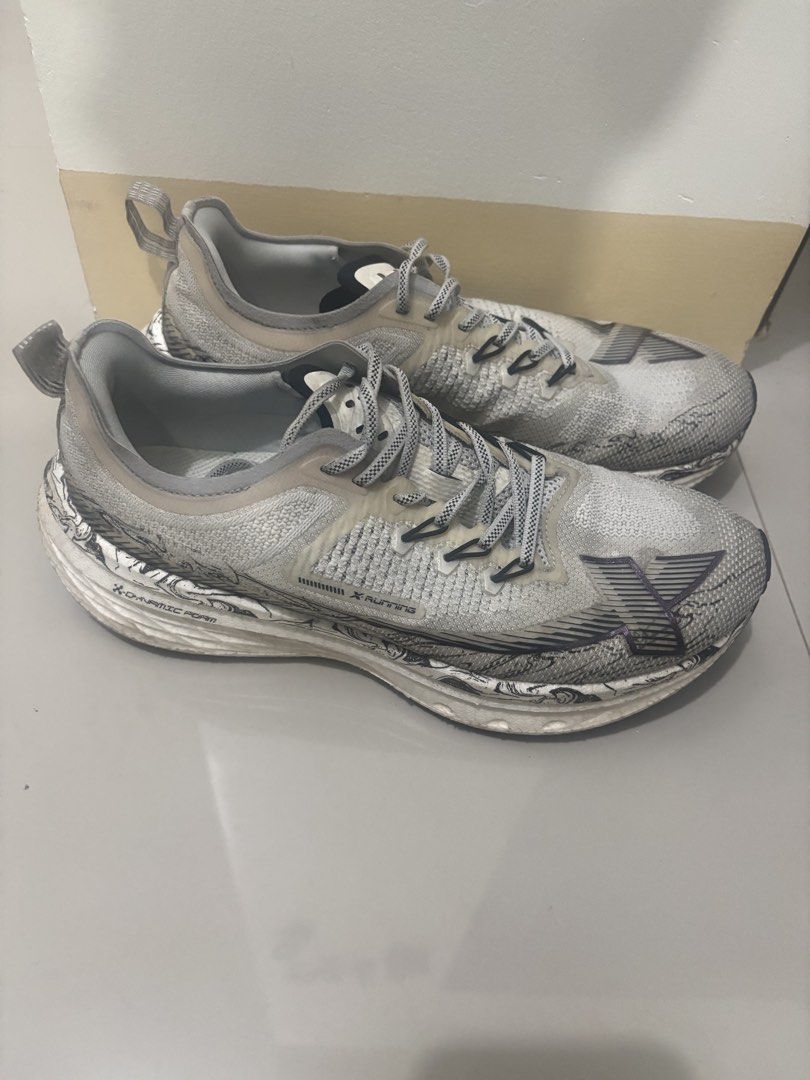 X-TEP Dynamic Foam Running Shoes Grey White (Category: Sneakers) located in Meycauayan. Submitted by retroselectionph (Listing ID 1466558657, Image 2). Description: - Brand: X-TEP Running Shoes - Colorway: White and grey knit upper with black graphic details - Cushioning: Thick midsole with Dynamic Foam for responsive comfort - Features: Patterned laces and convenient heel pull tabs - Outsole: Durable black rubber traction pods for grip - Conditi