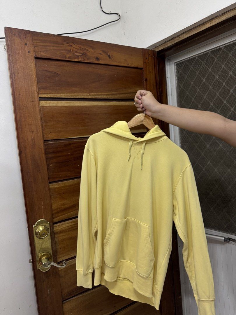 Yellow Hoodie with Front Pocket and Drawstrings (Category: Coats, Jackets and Outerwear) located in Cavite. Submitted by yakultjeni85475 (Listing ID 1466477128, Image 2). Description: - Color: Bright yellow - Style: Casual everyday hoodie with regular fit - Features: Front kangaroo pocket, adjustable drawstrings, and stitched V-insert at the collar - Details: Ribbed cuffs and hem for extra comfort - Material: Cozy cotton-blend.