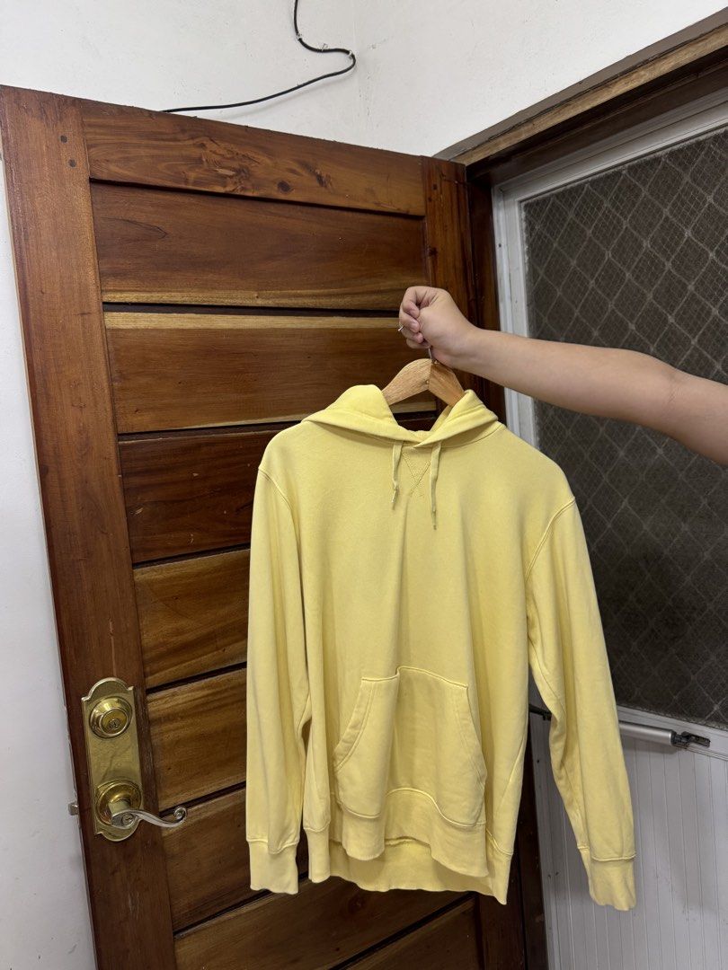 Yellow Hoodie with Front Pocket and Drawstrings (Category: Coats, Jackets and Outerwear) located in Cavite. Submitted by yakultjeni85475 (Listing ID 1466477128, Image 3). Description: - Color: Bright yellow - Style: Casual everyday hoodie with regular fit - Features: Front kangaroo pocket, adjustable drawstrings, and stitched V-insert at the collar - Details: Ribbed cuffs and hem for extra comfort - Material: Cozy cotton-blend.