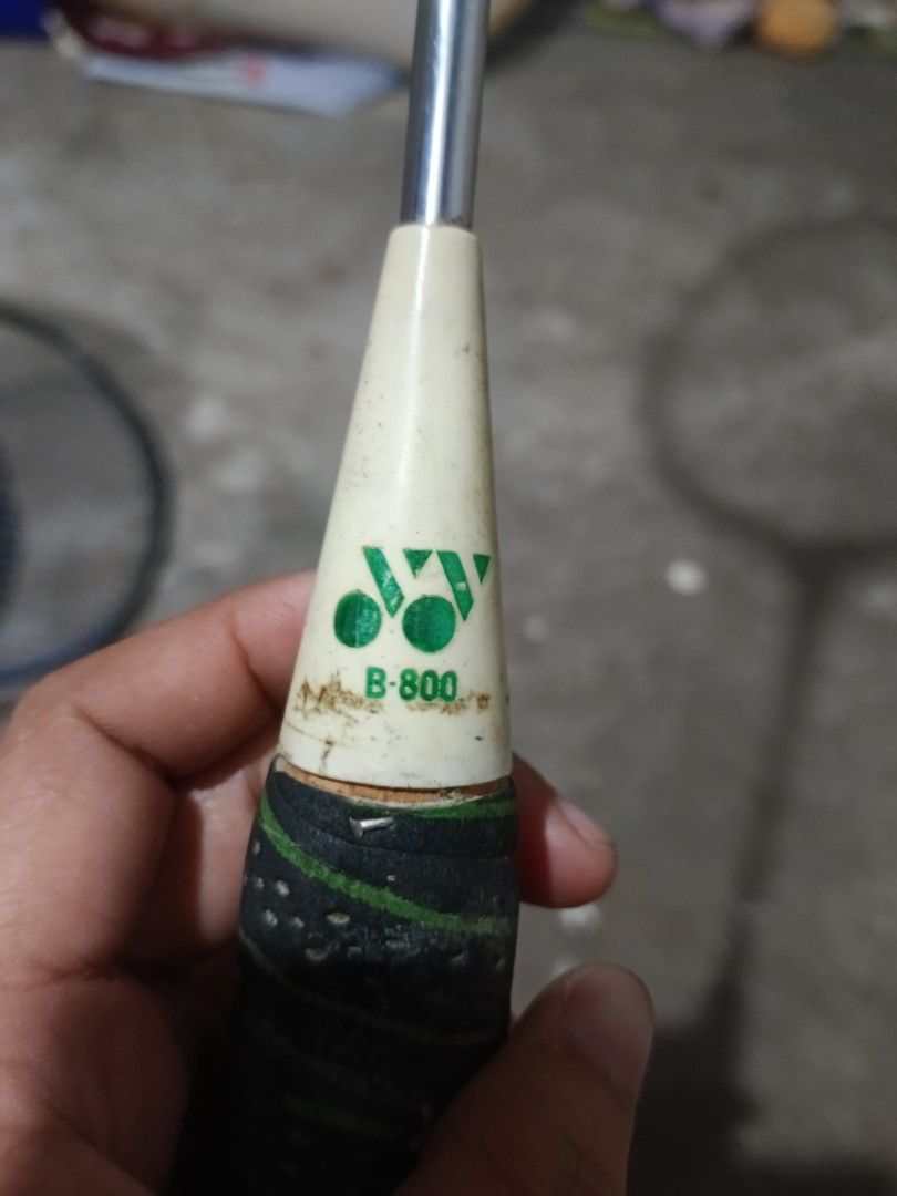 Yonex B-800 Badminton Racket (Category: Racket and Ball Sports) located in Valenzuela. Submitted by relchris22 (Listing ID 1466352348, Image 2). Description: - Model: Vintage Yonex B-800 badminton racket - Design: White frame with striking blue and green accents - Build: traditional wooden head with strung net - Handle: Wrapped grip in green and black .