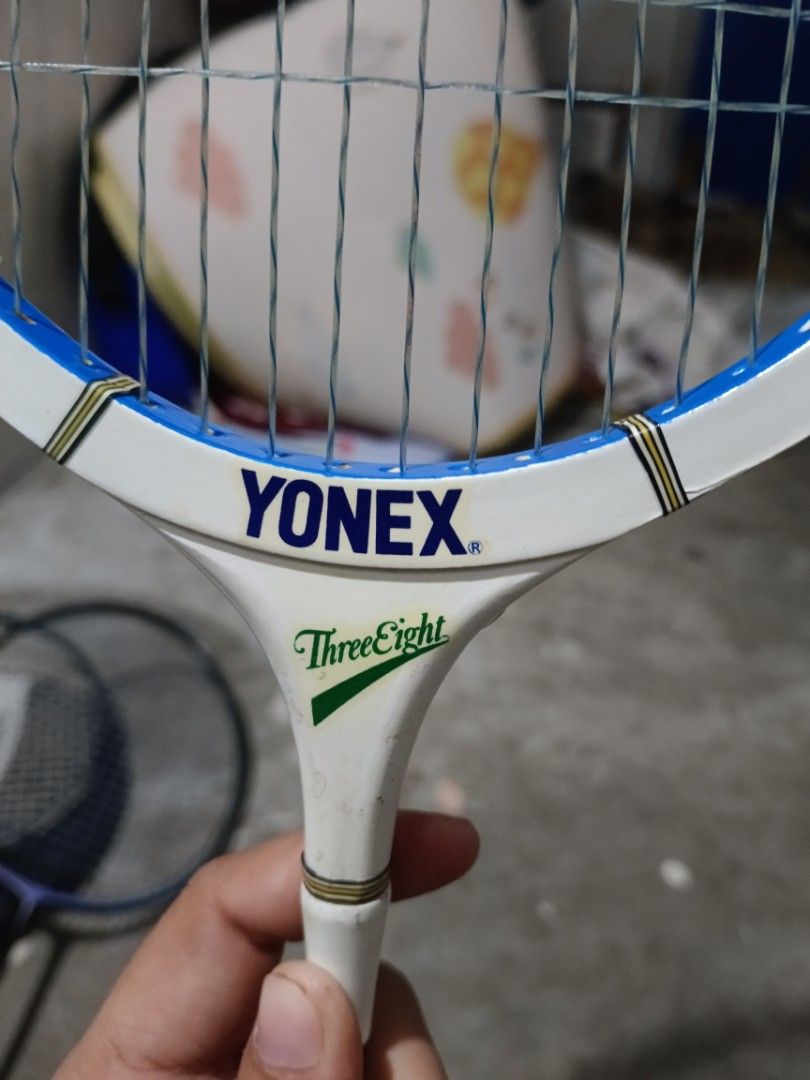 Yonex B-800 Badminton Racket (Category: Racket and Ball Sports) located in Valenzuela. Submitted by relchris22 (Listing ID 1466352348, Image 3). Description: - Model: Vintage Yonex B-800 badminton racket - Design: White frame with striking blue and green accents - Build: traditional wooden head with strung net - Handle: Wrapped grip in green and black .