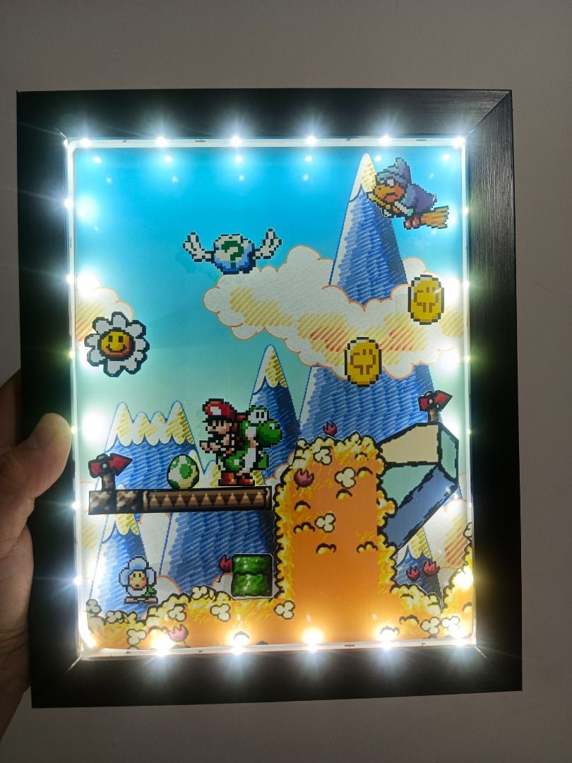 Yoshi's Island Video Game Shadow Box (Category: Nintendo) located in Quezon City. Submitted by natzuki10 (Listing ID 1466358996, Image 2). Description: Yoshi's Island Video Game Shadow Box Height: 10 inches Width: 8 inches 750 w/o lights 920 w/ lights *Handmade Pixel Shadow Boxes *Accepting Customized Designs *Perfect for Gamers & Collectors #videogames #nintendo #roomdecor #collection #gamer #gift.