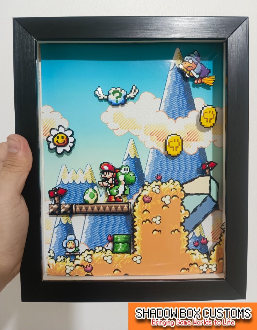 Yoshi's Island Video Game Shadow Box (Category: Nintendo) located in Quezon City. Submitted by natzuki10 (Listing ID 1466358996, Image 1). Description: Yoshi's Island Video Game Shadow Box Height: 10 inches Width: 8 inches 750 w/o lights 920 w/ lights *Handmade Pixel Shadow Boxes *Accepting Customized Designs *Perfect for Gamers & Collectors #videogames #nintendo #roomdecor #collection #gamer #gift.