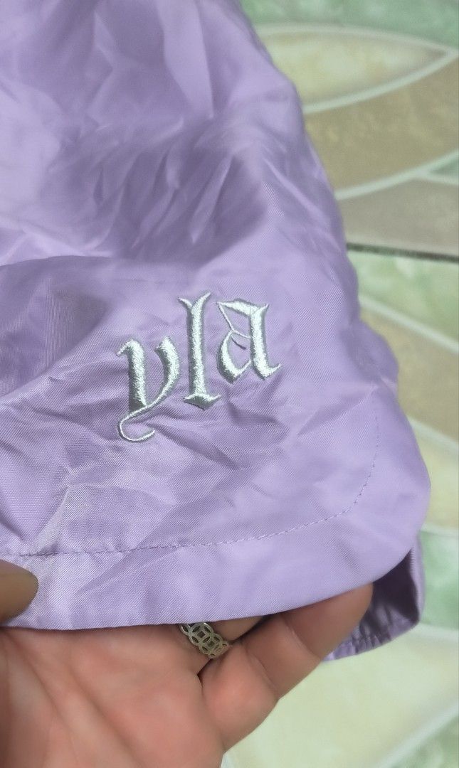 YoungLA Purple Shorts YLA2461 Medium (Category: Shorts) located in Manila. Submitted by itsmelawrence (Listing ID 1466357961, Image 3). Description: - Brand: YoungLA (Model YLA2461) - Size: Medium 31+ x17 - Color: Light Purple - Condition: Brand new with original store tags attached - Material: 100% polyester with breathable mesh inner lining - Features: Adjustable drawstring waist and embroidered logo near the hem - Care: Machine wash cold.