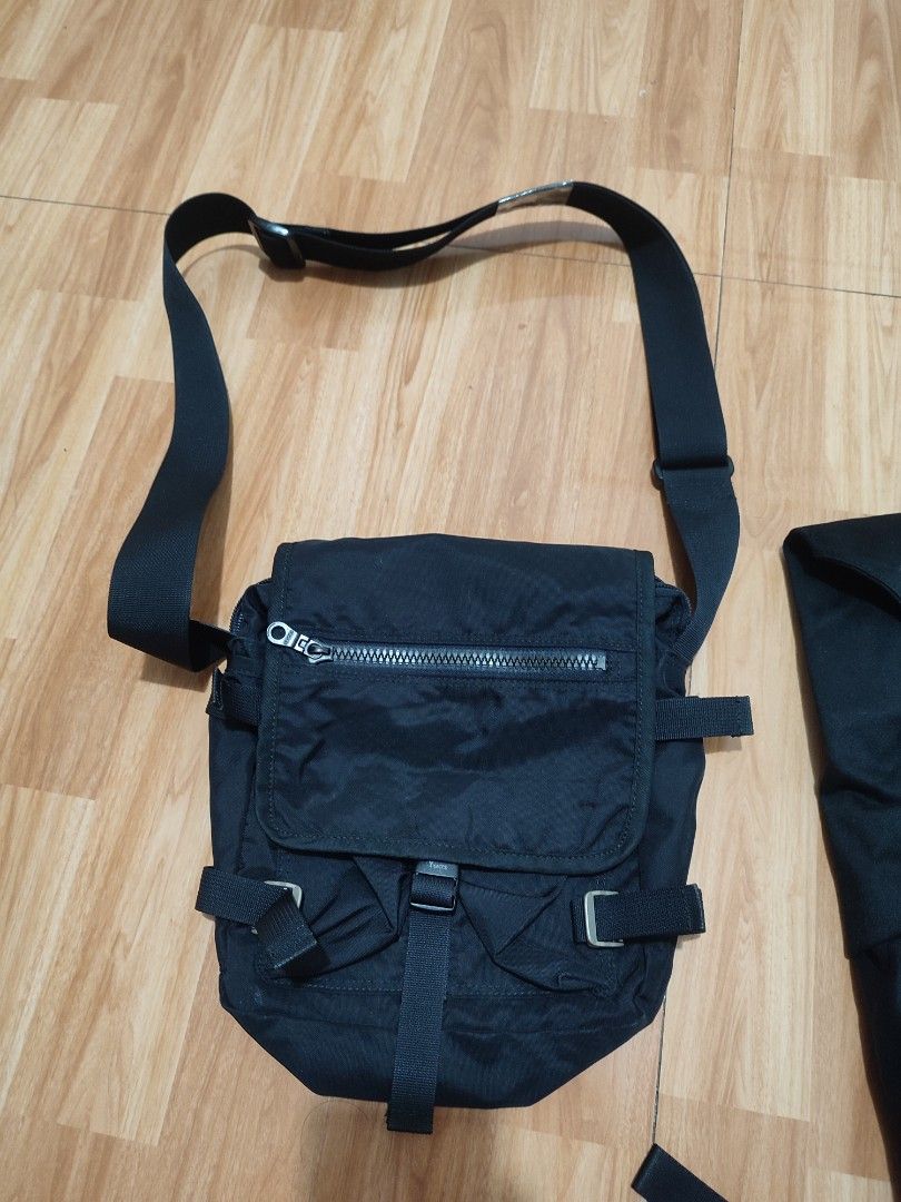 Ysacs Slingbag (Category: Sling Bags) located in Lipa City. Submitted by gudoys_outdoor16 (Listing ID 1466468460, Image 2). Description: - Color: Sleek Black - Material: Durable, high-quality nylon - Style: Tactical utility crossbody bag - Strap: Adjustable for a custom fit - Pockets: Front flap pocket with top zipper compartment - Closure: Secure buckle main compartment - Extras: Multiple side strap details for a rugged look - Size: Compact and 