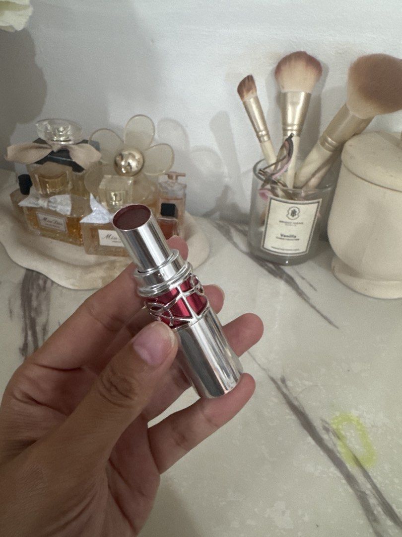 YSL Rouge Volupte Shine Lipstick (Category: Makeup) located in Marikina City. Submitted by nettenette26 (Listing ID 1466417939, Image 1). Description: - Brand: Yves Saint Laurent (YSL) - Shade: Dark berry (great for daily wear or nights out) - Packaging: Silver tube with a pink band - Usage: Used a couple of times, plenty of product left - Storage: Well-kept in a cool, clean makeup room Swatch only with box Shade 03.
