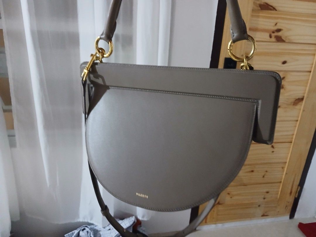 Yuzefi taupe leather shoulder bag (Category: Shoulder Bags) located in Quezon City. Submitted by mcenon35 (Listing ID 1466479317, Image 2). Description: - Brand: Yuzefi - Color: Taupe - Material: Premium leather - Style: Structured half-moon shoulder bag - Hardware: Gold-tone - Straps: Top handle and long adjustable strap - Origin: Made in Spain - Condition: Clean surface, sturdy construction.