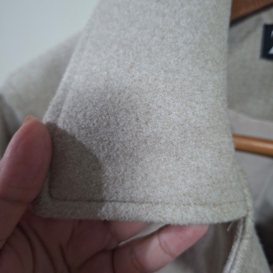 Zara Beige Cropped Wool Blend Jacket (Category: Coats, Jackets and Outerwear) located in Quezon City. Submitted by arargarcia (Listing ID 1466461160, Image 3). Description: - Brand/Style: Zara beige cropped jacket - Material: Structured wool blend with clean interior lining - Closure: Button front with matching button cuffs - Details: Large lapels and dual front chest pockets - Condition: Excellent, with standard Zara tag.