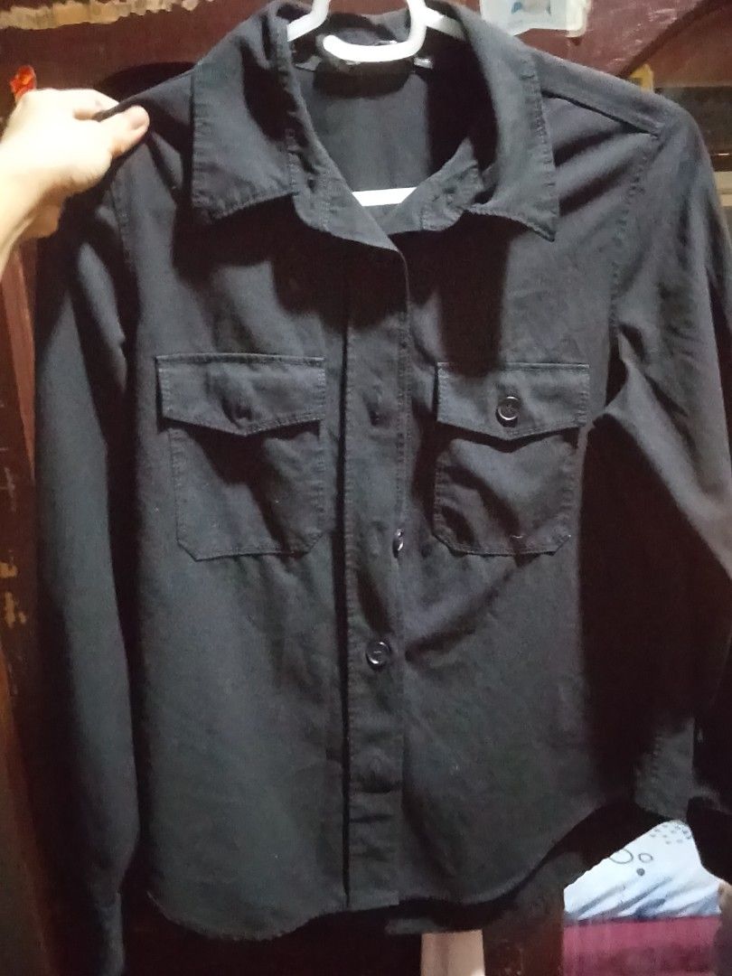 Zara black button down long sleeve shirt (Category: Longsleeves) located in Makati City. Submitted by princesses71451 (Listing ID 1466458257, Image 1). Description: - Brand: Zara - Color: Classic black (dark neutral tone) - Style: Long sleeve, button-down with classic collar and two front chest pockets - Origin: Made in Morocco - Versatility: Perfect for layering or wearing solo; easily pairs with jeans or slacks.