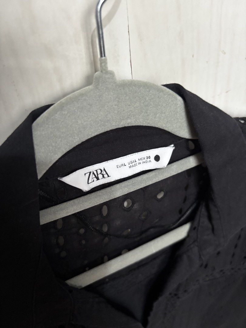 Zara Black Eyelet Lace Button Down Shirt Blouse (Category: Blouses) located in Quezon City. Submitted by anacon (Listing ID 1466357970, Image 2). Description: - Brand: Zara - Color: Black - Size: EUR L / USA L / MEX 30 (Standard fit) - Design: Long sleeves, collar, with all-over eyelet embroidery and lace cutouts - Material: Lightweight, made in India - Condition: Great for casual or dressed-up looks - Mode of Payment: GCash or BPI - Shipping: Vi