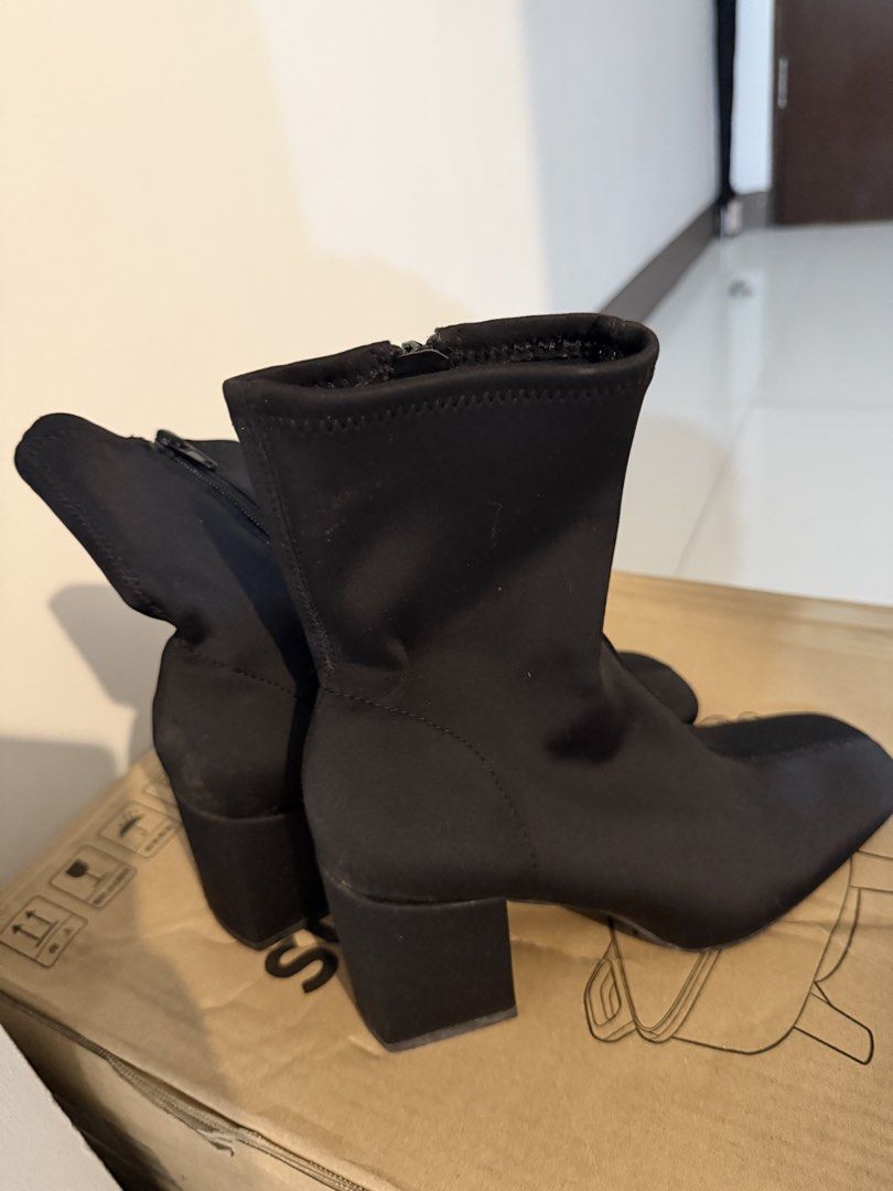 Zara Black Square Toe Heeled Boots Size 37 (Category: Boots) located in Taguig. Submitted by mengxir20193848 (Listing ID 1466524403, Image 1). Description: - Brand: Zara - Style: Stretch fabric ankle boots with square toe and chunky block heel - Size: 37 (marked on inner insole and sole) - Closure: Side zipper for easy wear - Condition: Clean soles with minimal wear, as seen in photos - Perfect for daily wear, work, or night outs!.