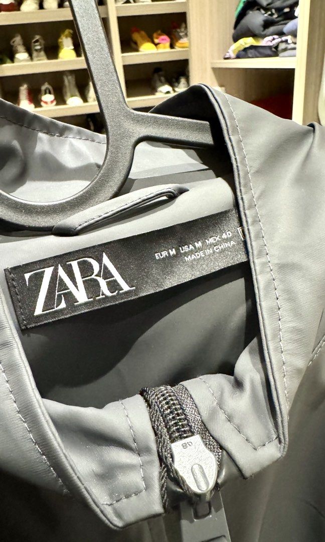 Zara Grey Jacket Size M (Category: Coats, Jackets and Outerwear) located in Quezon City. Submitted by helloimcharles (Listing ID 1466458887, Image 3). Description: - Brand: Zara - Style: Hooded jacket - Color: Dark grey - Size: Medium (EUR M, USA M, MEX 40) - Condition: Brand new with original tags attached - Features: Full zip closure, ribbed cuffs and hem, two side slip pockets - Material: Lightweight outerwear, great for daily use.