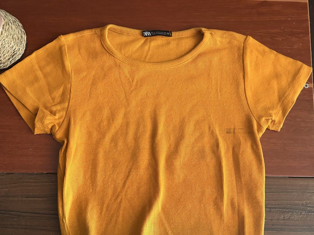 Zara Ribbed Crop Top Bundle Size XS (Category: Shirts) located in Minalabac. Submitted by summerrish (Listing ID 1466349544, Image 2). Description: - Brand: Zara - Quantity: Set of 3 crop tops - Colors: Mustard yellow, dark mustard, bright green - Design: Short sleeves, round neckline - Material: Stretchy, comfortable fabric - Style: Great basic pieces for casual everyday wear.