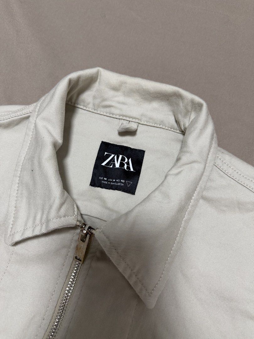 Zara Zip-Up Overshirt Cream Size M (Category: Coats, Jackets and Outerwear) located in Manila. Submitted by poreberqueeen (Listing ID 1466354421, Image 3). Description: - Brand: Zara - Style: Zip-up overshirt - Color: Cream - Size: M (Regular fit) - Material: Durable cotton twill with a structured feel - Features: Full front metal zipper, classic pointed collar, two chest flap pockets - Condition: Worn a few times, minimal signs of wear - Versati