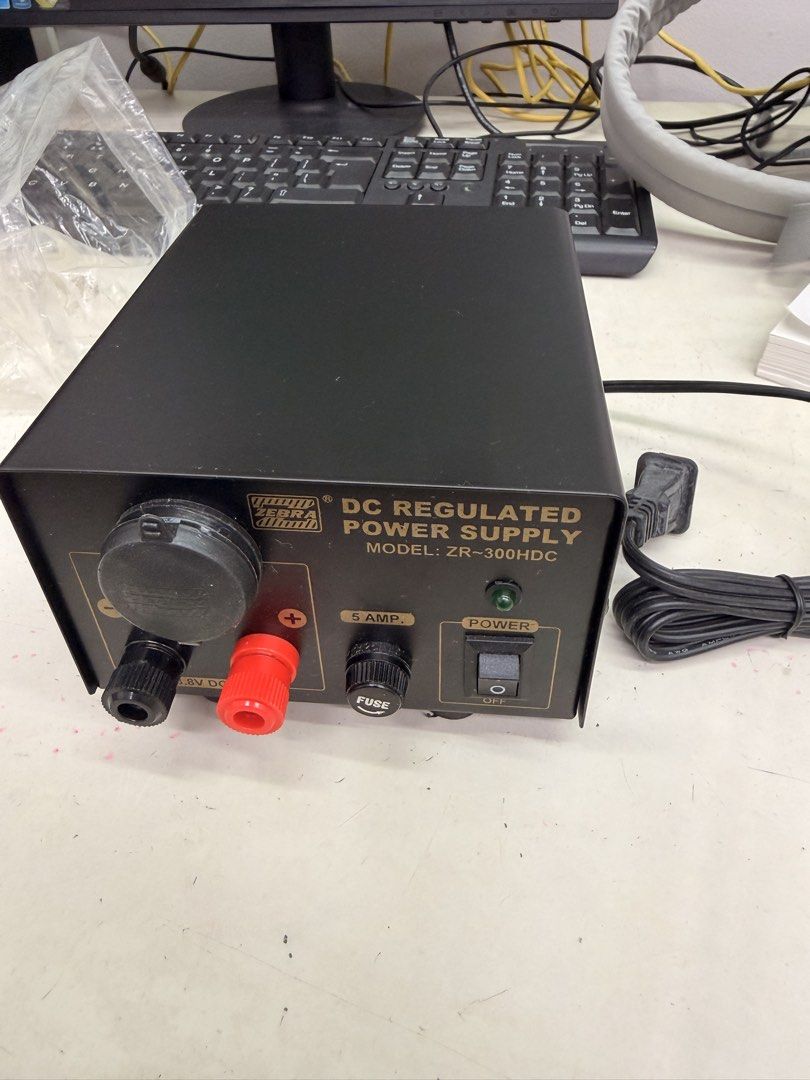 Zebra ZR-300HDC DC Regulated Power Supply 5 Amp (Category: Electrical, Adaptors & Sockets) located in Manila. Submitted by officialrodz (Listing ID 1466371809, Image 1). Description: - Model: Zebra ZR-300HDC DC Regulated Power Supply Unit - Condition: Tested and fully working, powers on normally with a clean exterior (minor handling marks only) - Design: Sturdy black metal casing with standard red and black binding posts - Front Panel: Includes p