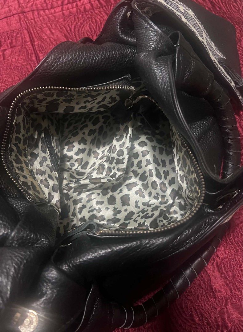ZM Designer-Inspired Leather Tote Bag (Category: Purses & Pouches) located in Antipolo. Submitted by richsoulx (Listing ID 1466561969, Image 3). Description: ZM Designer-Inspired Leather Tote Bag Retail equivalent: $90 USD Selling because decluttering. Bag is in Very Good condition 8.5/10 DETAILS: - Material: Genuine leather exterior with snakeskin print trim - Interior: Full leopard print lining + zip pocket + zip closure - Size: Large tote. Fit