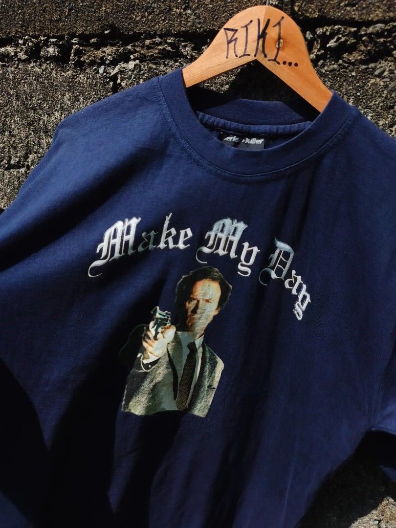00s Serial Killer "Dirty Harry" 🔫 (Category: Tshirts & Polo Shirts ) located in Butuan. Submitted by karaangnina (Listing ID 1466693118, Image 1). Description: 00s Serial Killer "Dirty Harry" 🔫 Medium 20.5W x 28.5L 📥 - Brand: Serial Killer - Color: Dark blue - Design: Clint Eastwood graphic with 'Make My Day' gothic lettering - Fit: Classic crew neck with short sleeves - Material: Soft fabric with natural, vintage-style fading from wear - Cond