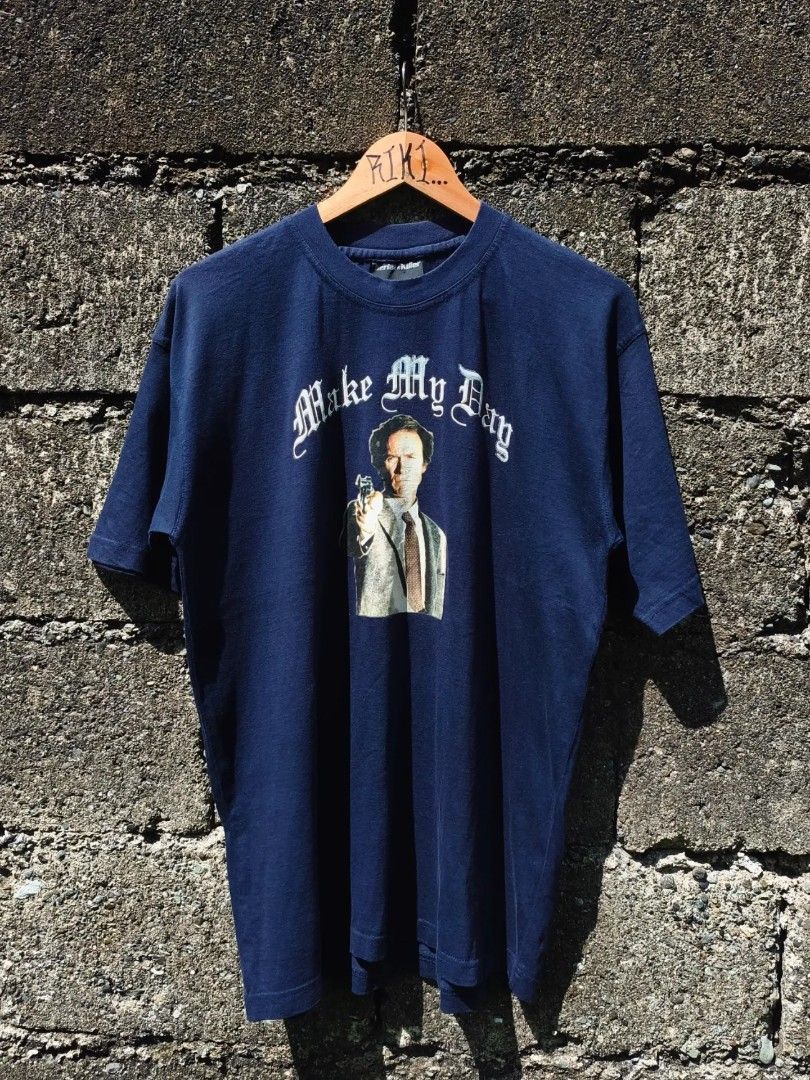 00s Serial Killer "Dirty Harry" 🔫 (Category: Tshirts & Polo Shirts ) located in Butuan. Submitted by karaangnina (Listing ID 1466693118, Image 2). Description: 00s Serial Killer "Dirty Harry" 🔫 Medium 20.5W x 28.5L 📥 - Brand: Serial Killer - Color: Dark blue - Design: Clint Eastwood graphic with 'Make My Day' gothic lettering - Fit: Classic crew neck with short sleeves - Material: Soft fabric with natural, vintage-style fading from wear - Cond