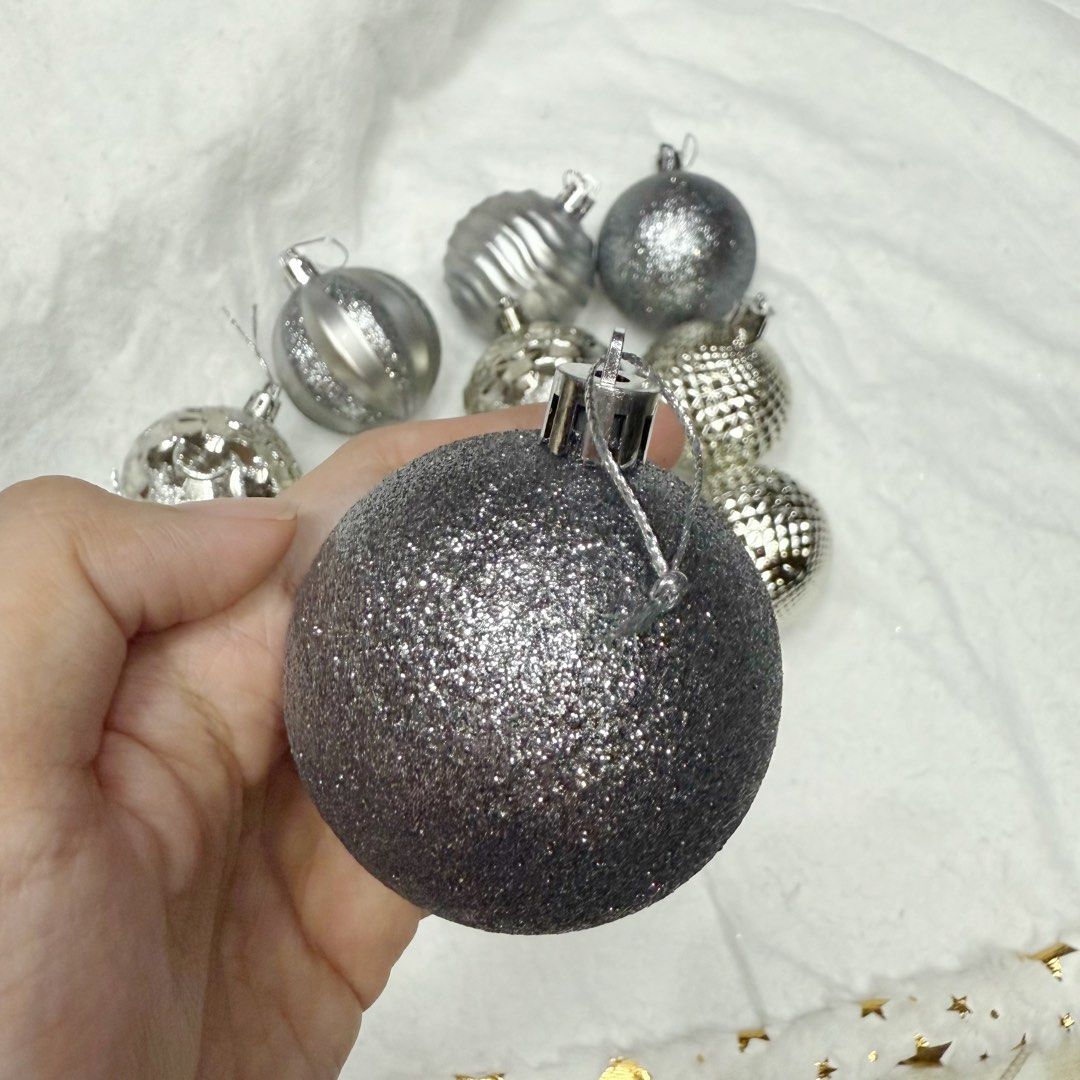 12pcs Silver christmas baubles tree decorations set (Category: Vintage Collectibles) located in Marikina City. Submitted by lovegoeson (Listing ID 1466595995, Image 3). Description: - Set of assorted silver Christmas baubles - Includes glitter, ribbed, patterned, and textured metallic finishes - Comes with a convenient silver hanging loop on each ornament - Great mix of styles to elevate your holiday tree decor.