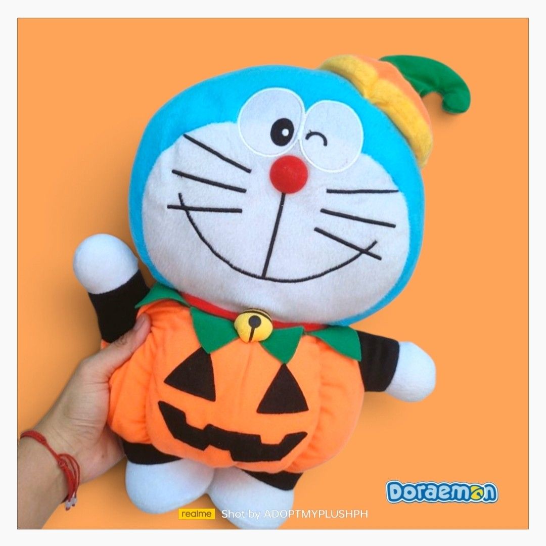 14" Doraemon Halloween-themed plush (Category: Plushies & Soft Toys) located in Taguig. Submitted by adopt.my.plush.ph (Listing ID 1465306724, Image 1). Description: 14" Halloween-themed Doraemon plush toy wearing a pumpkin costume and a matching hat *as is, toy label was cut-off/removed.
